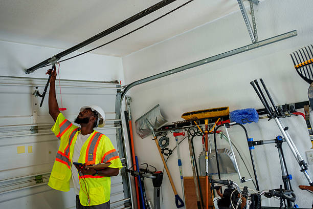 Professional Garage Door Panel Replacement technician working in Clarence, IA